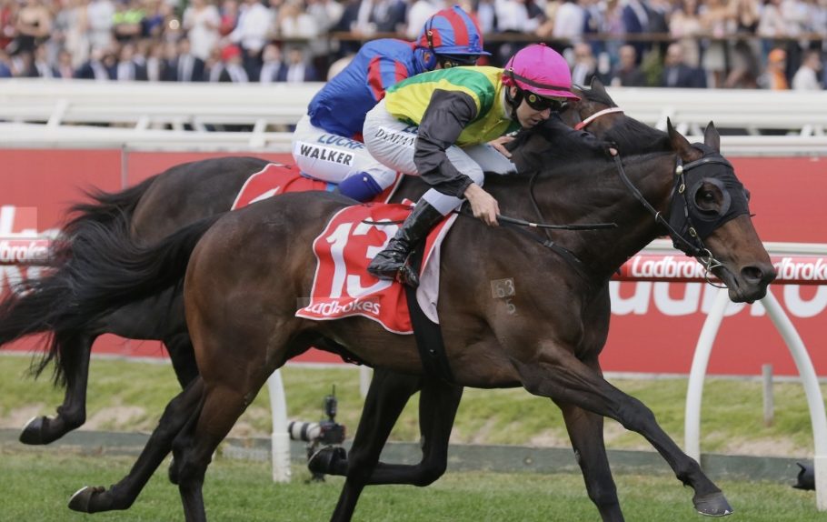 A tight finish between horses at the post